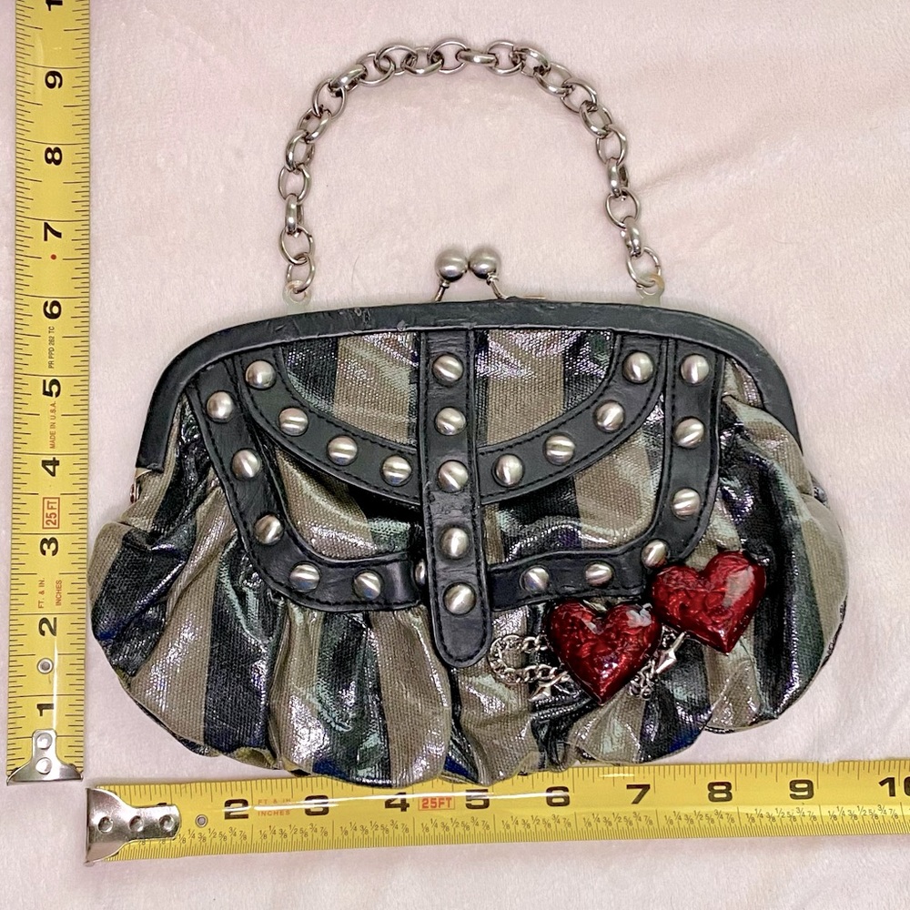 Betsey Johnson Betseyville striped purse with metal accents and heart arrow pins